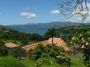 From the owner's home at the top of the property, the view passes over the pool, restaurant, fitness building, tennis courts and other features to Lake Arenal and the mountains beyond